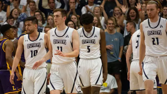 Ivan Gandia-Rosa, Garrett Sams, Dorian James and Josh Endicott walk off the floor