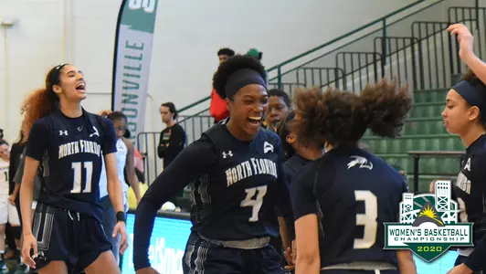 UNF women's basketball celebrates after winning against Jacksonville in the ASUN quarterfinals