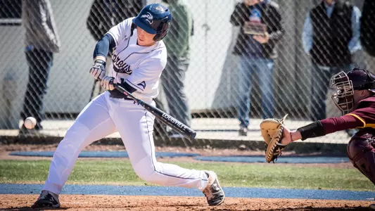 Grant Grodi swings the bat low at the ball