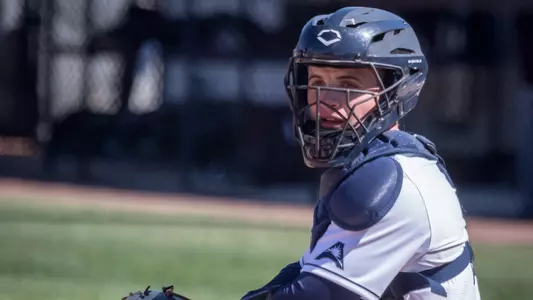 Austin Hurwitz looks on to make the catch from the pitcher at home plate