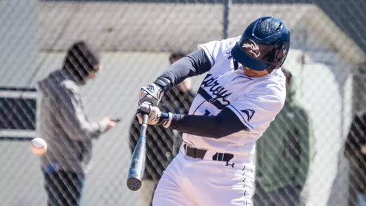 Two players fist bump on the field