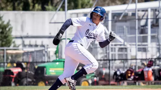 Two players go for the ball