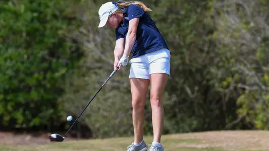 Teresa Conroy hits a drive off a tee
