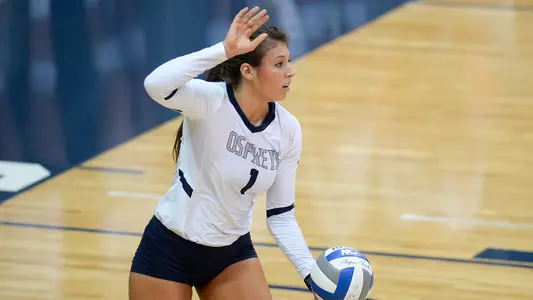 Carina Hoff is about to serve the ball