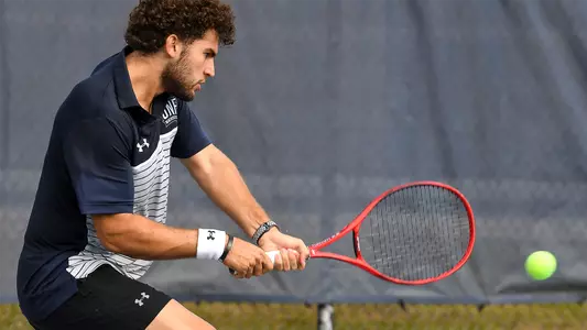 Rodrigo Crespo hitting a two-hand backhand.