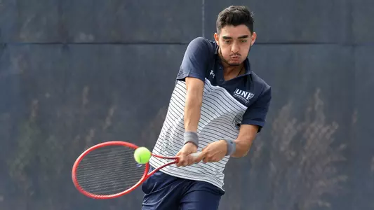 Jorge Nunez hits a backhand.