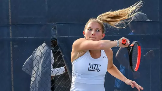 Annabelle Davis swings her racket.