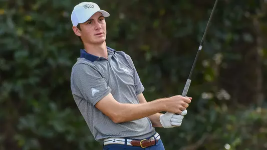 Nick Gabrelcik watches his tee shot fly down the fairway