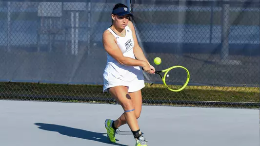 Anapaula Melilo Striking a Backhand