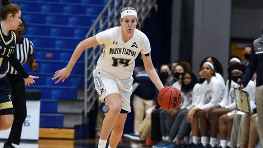 Erin Jones dribbles the basketball against FIU