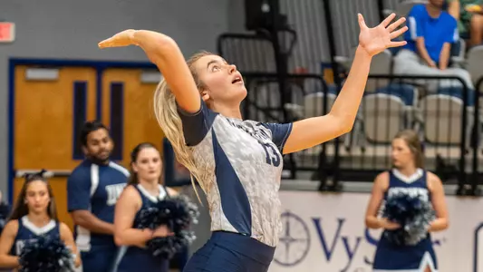 Annie Antar serves the ball