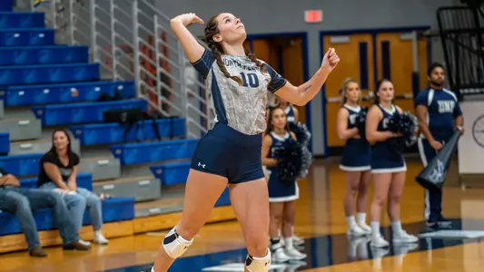 Grace Youngblood serves the ball