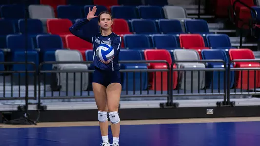 Logan O'Brien prepares to serve the ball.