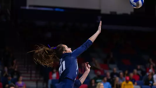 Grace Youngblood serves the ball