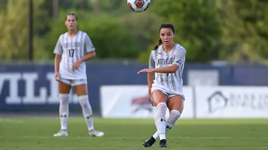 Averi Walraven kicks the ball up the field