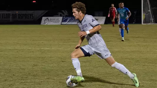 Zach Board dribbling against Florida Gulf Coast