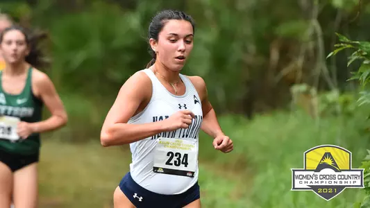picture of mia mclain running with an asun logo