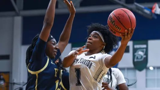 Nubia Benedith drives in for a layup.