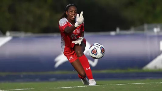 Mercedes Sapp rolls the ball toward a teammate