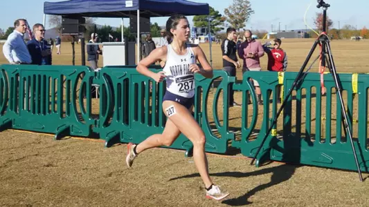 Mia McLain South regional meet running to finish line