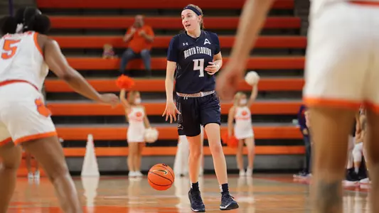 Erin Jones brings the ball up the court.