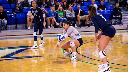 Rocio Moro digs the ball.