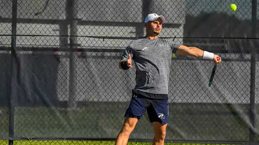 Joe Ellis hits a forehand
