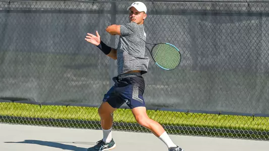 Joe Ellis hits a forehand