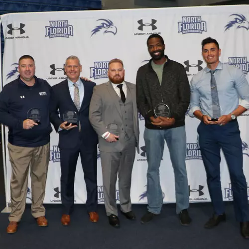 Stephen Perkins, Bobby Kennen, Chase Driscoll, Demarcus Daniels, Aaron Bodager pose with their HOF trophyt
