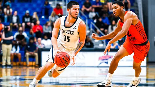 Jose Placer dribbling to the hoop