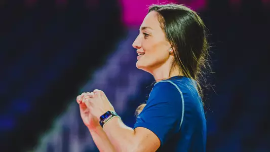 Kayla Oxenrider coaching on the sidelines