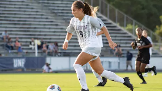 Carmel Oliveira dribbling the ball up field