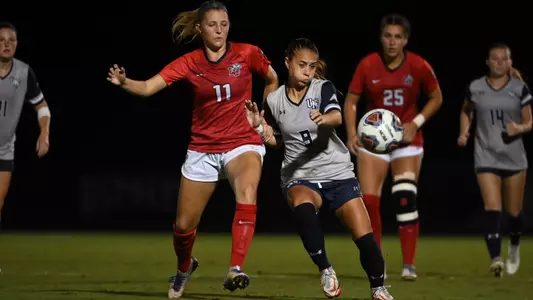 Carmel Oliveira passing the ball