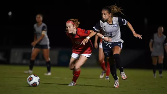 Carmel Oliveira dribbling past the defense