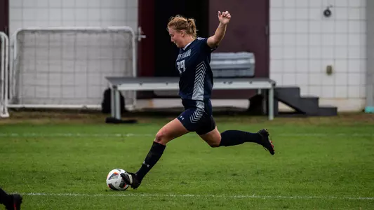 Kate Carter kicking the ball