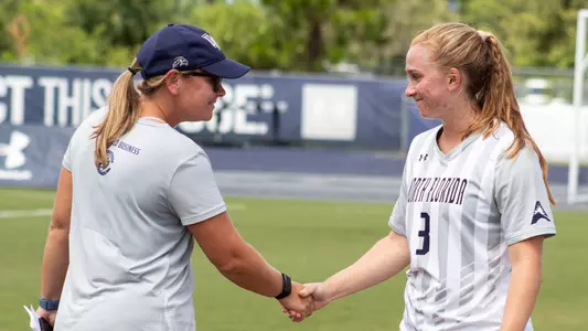 Sydney Hauth and Morgan Luckie shaking hands