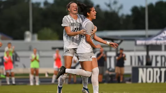 Thais Reiss and Kendra Hoffman celebrating