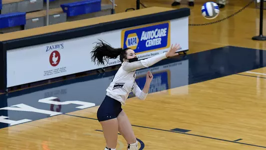 Grace Youngblood swings on a serve