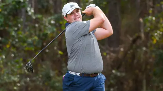 Michael Mattiace watches flight of ball following his swing from the tee
