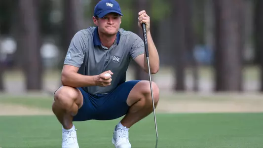 Nick Infanti lines up a putt on the green