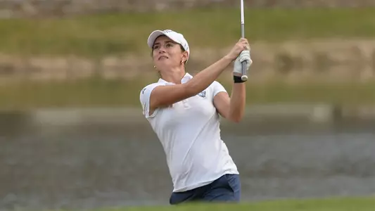 Marion Debove hits the ball out of a sand trap