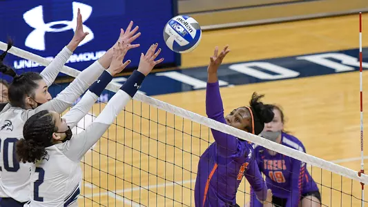 Kailey McKnight blocks the ball.