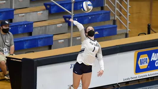 Logan O'Brien serves the ball.
