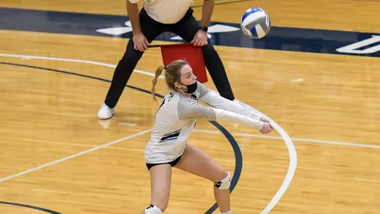 Logan O'Brien sets the ball.