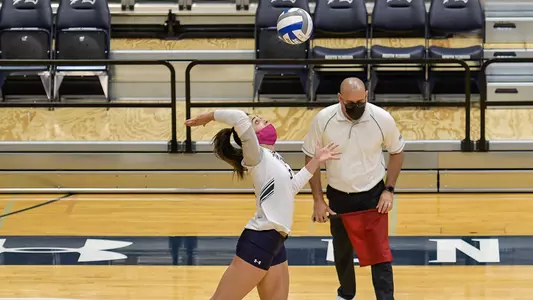 Gabby O'Connell serves the ball.