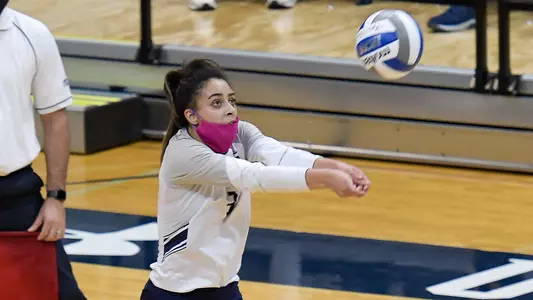 Gabby O'Connell sets the ball.