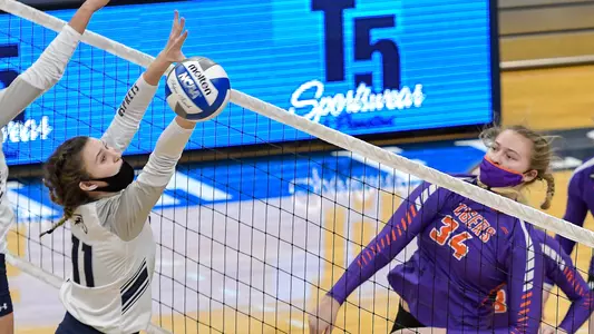 Bre Walp blocks the ball.