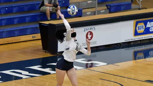 Grace Youngblood serves the ball.