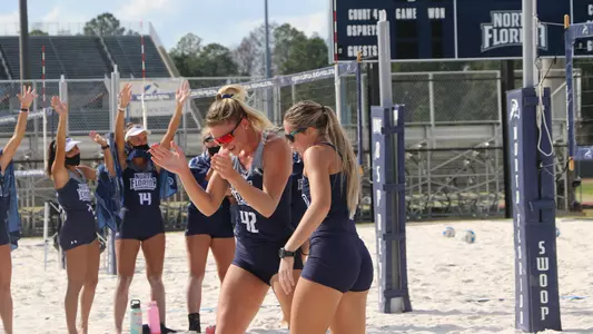 Taryn Griffey and Callie Workman celebrate a point