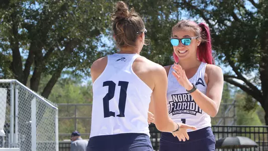 Dana Roskic and Antonia Harrison celebrate a point.